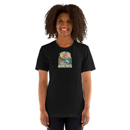 Woman modeling a black t-shirt with a mountain landscape and the words Take the Scenic Route on the front.