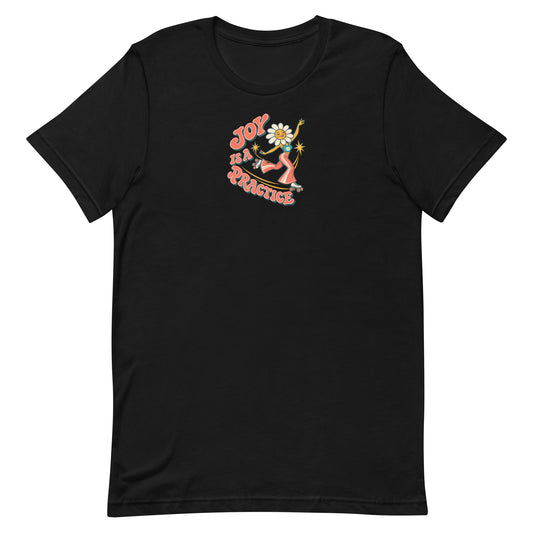 Flat front view of the black Joy Is a Practice T-shirt with its roller-skating flower graphic.