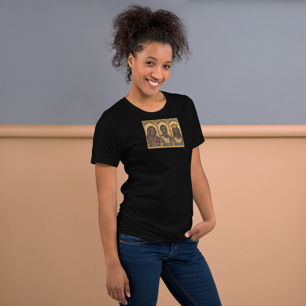 Right-side view of a model wearing the black Mary, Joseph & Yeshua graphic T-shirt.