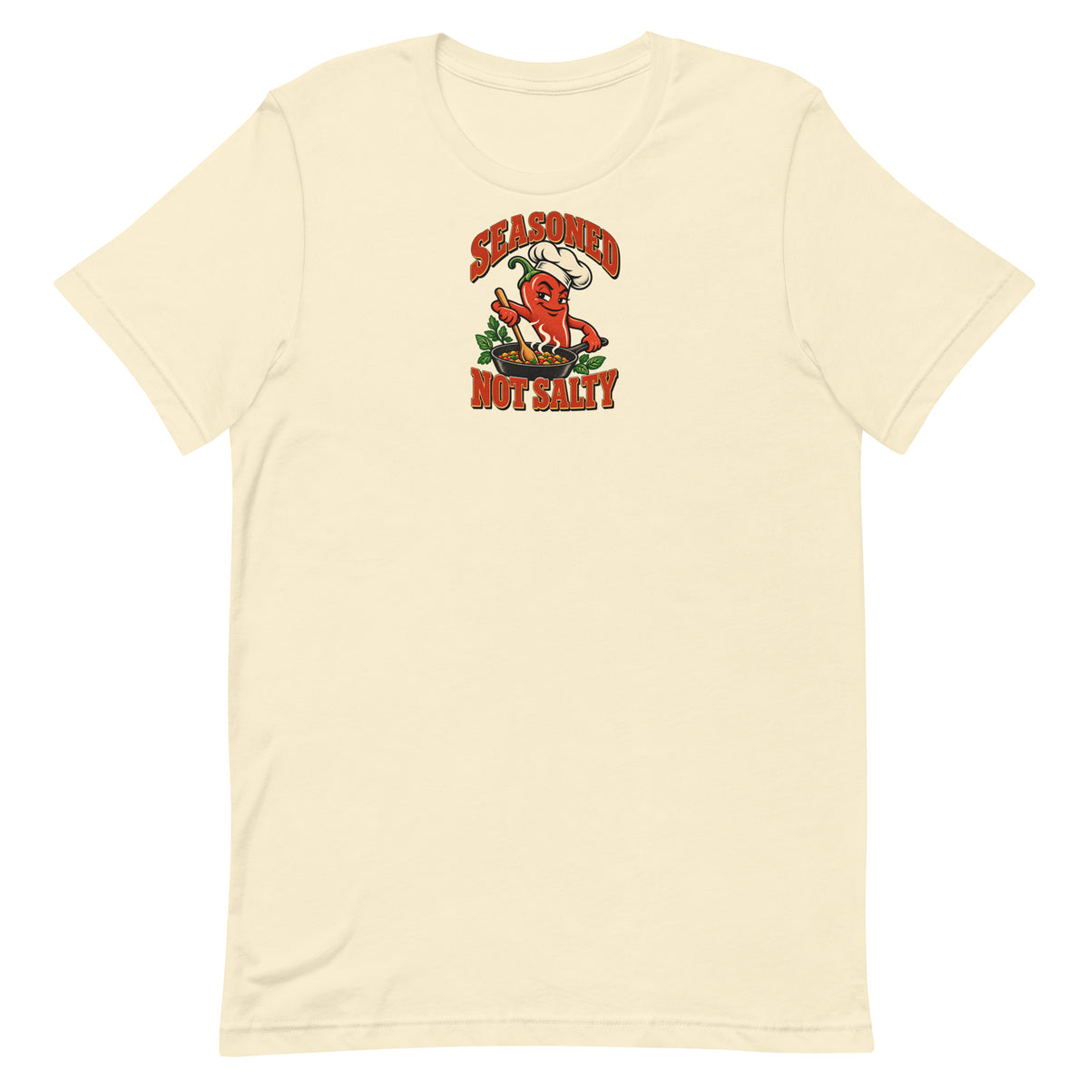 Front of a Natural Seasoned, Not Salty graphic T-shirt with a red chili-pepper chef stirring a skillet.
