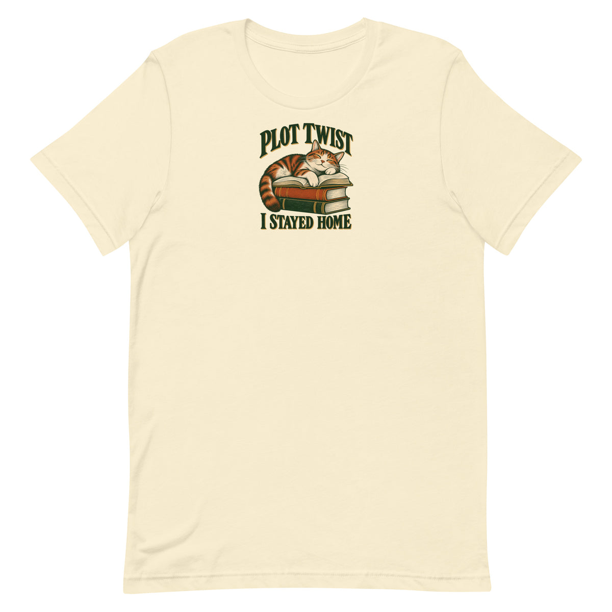 Natural cream T-shirt with a resting cat on stacked books and “Plot Twist I Stayed Home” lettering, front view.